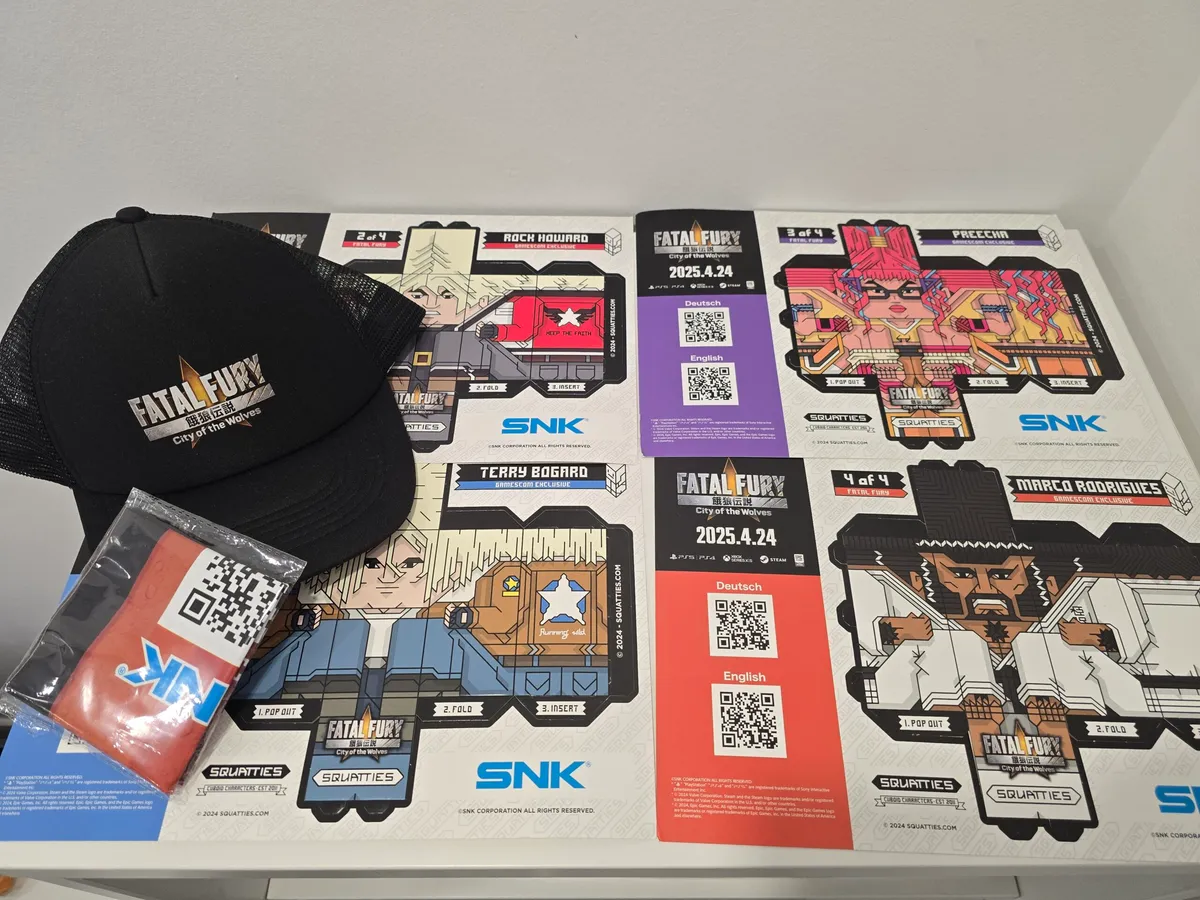 The four exclusive Squatties designs alongside additional Gamescom promotional merchandise.